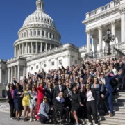 fitness industry leaders pose for a photo on the steps at Capitol Hill