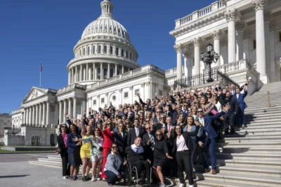 fitness industry leaders pose for a photo on the steps at Capitol Hill