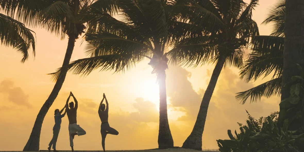 Yoga at the beach at sunset at Four Seasons.