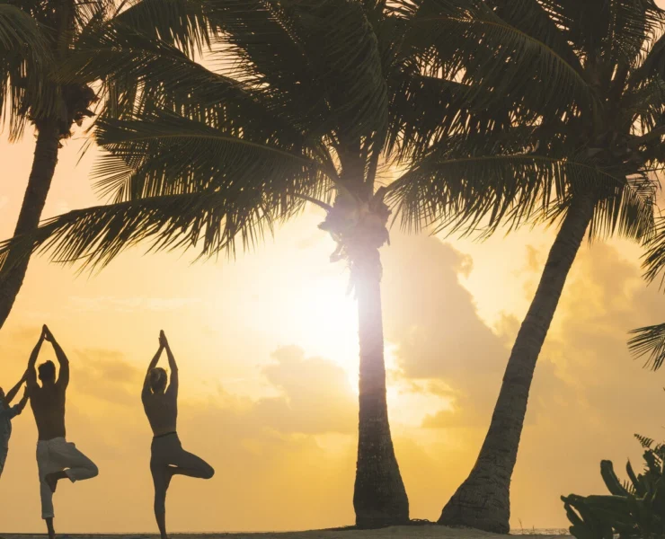 Yoga at the beach at sunset at Four Seasons.