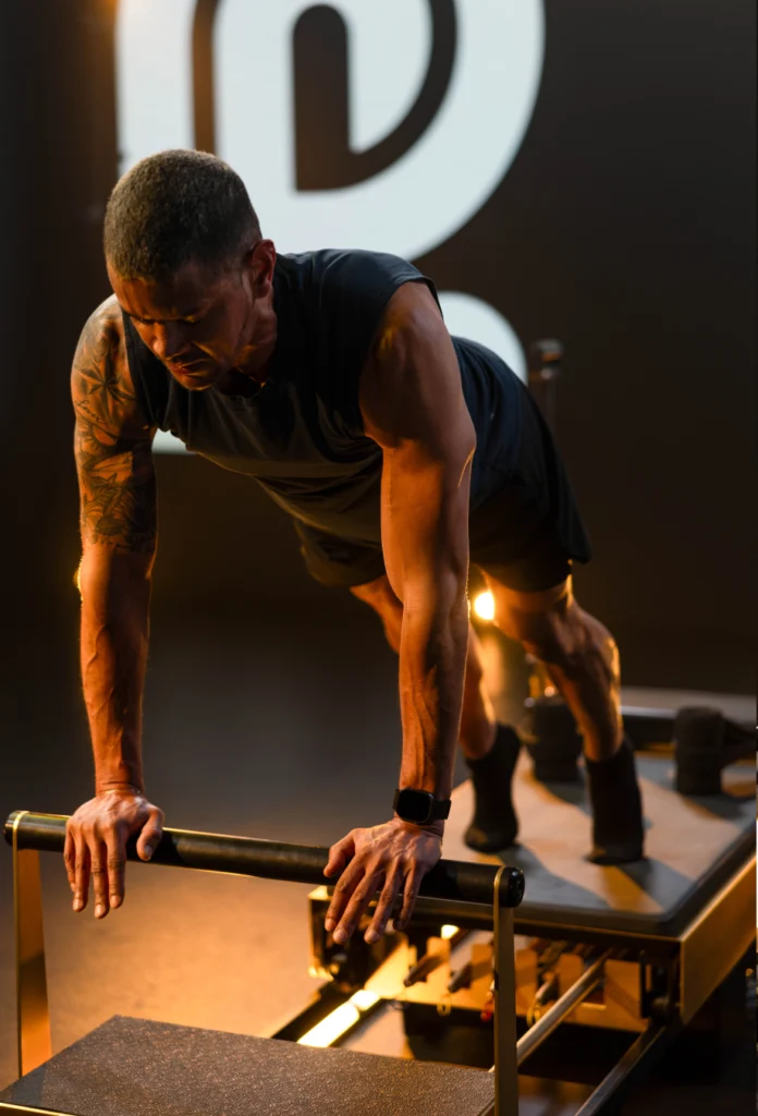 man on a Pilates reformer