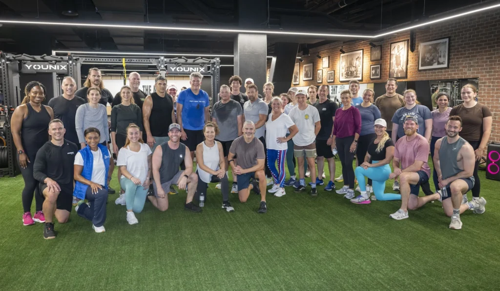 members of congress and fitness industry leaders work out together