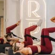 A class at Reforming Pilates with women using Reformers.