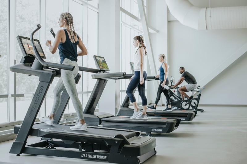 people on fitness equipment using iFIT programming