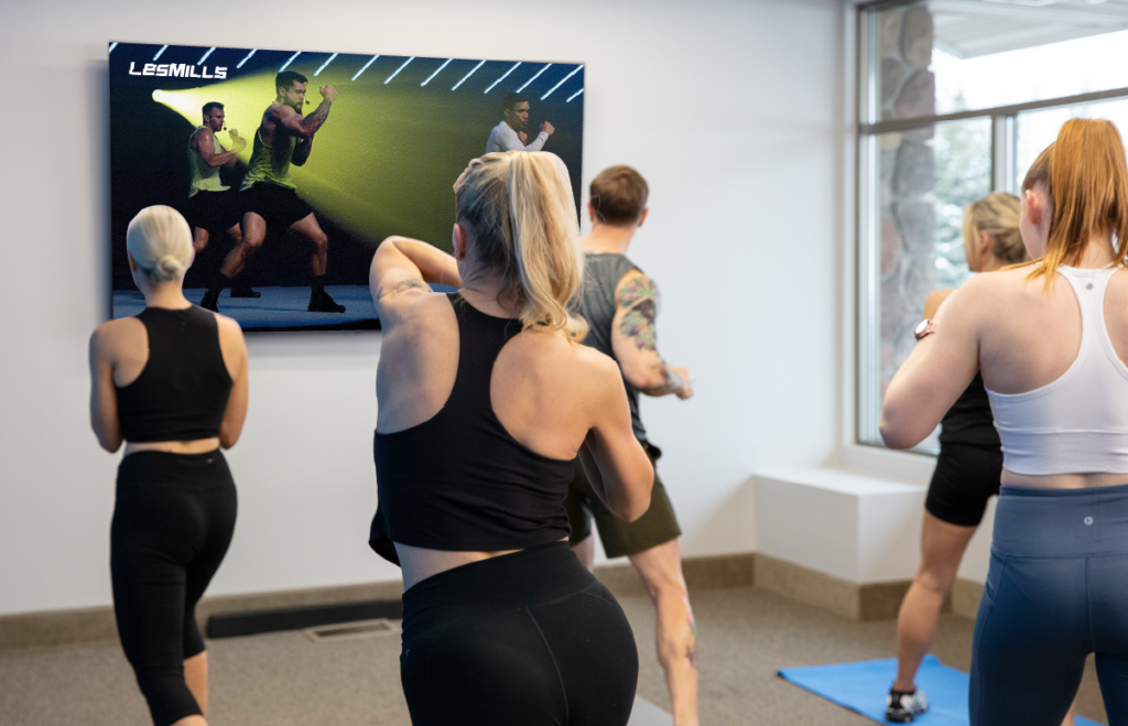 people work out to a Les Mills virtual fitness class