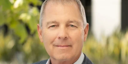 a headshot of Xpo CEO Mark King