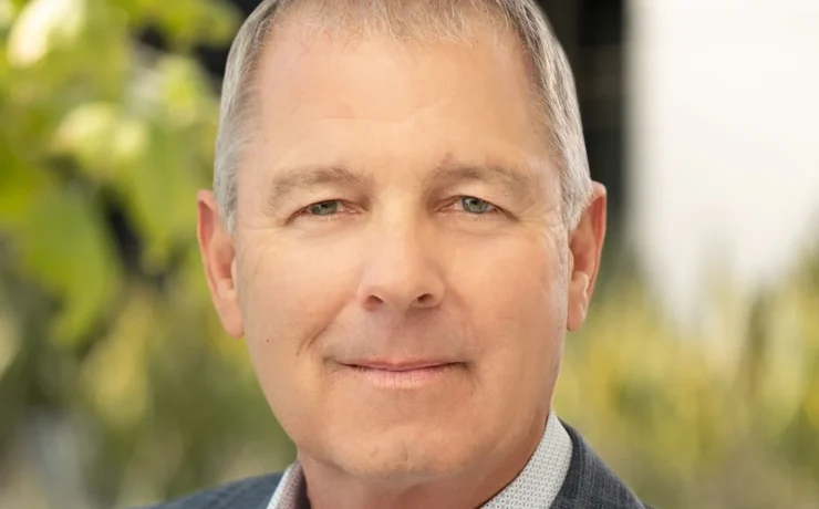 a headshot of Xpo CEO Mark King