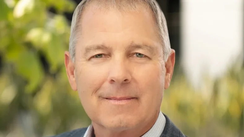 a headshot of Xpo CEO Mark King