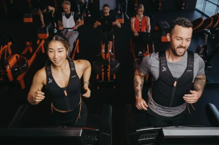Orangetheory members wearing Omorpho weighted vests.
