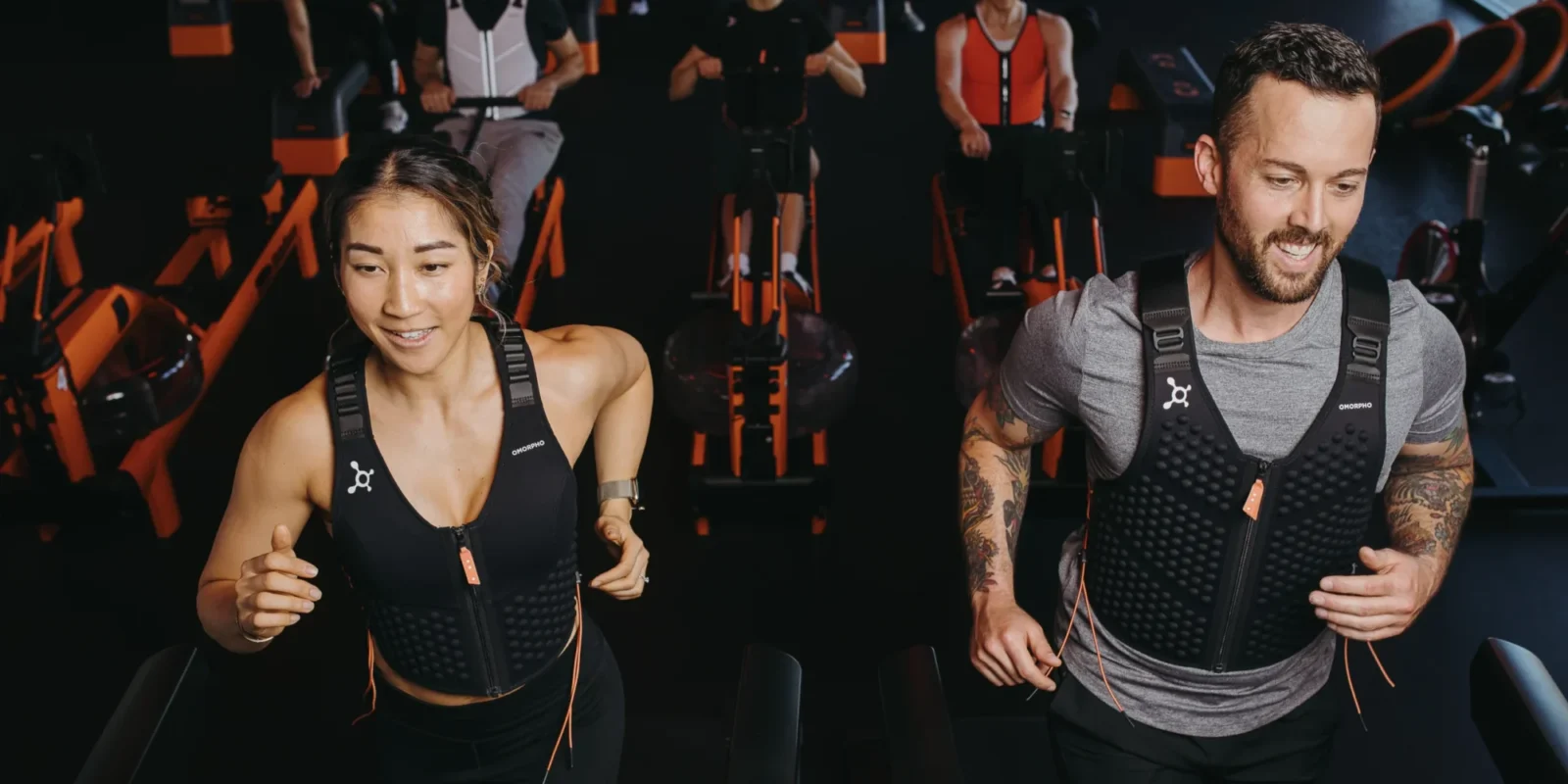 Orangetheory members wearing Omorpho weighted vests.