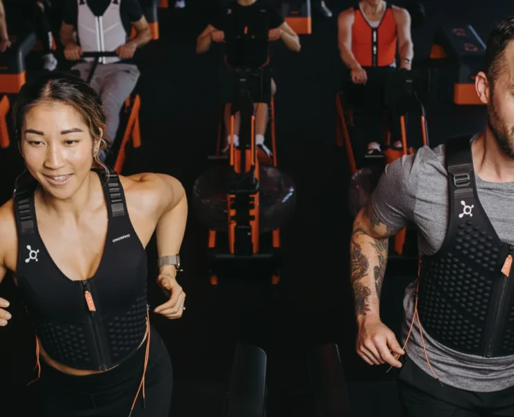 Orangetheory members wearing Omorpho weighted vests.