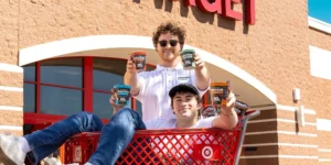 Protein Pints founders in a shopping cart outside of a Target store.