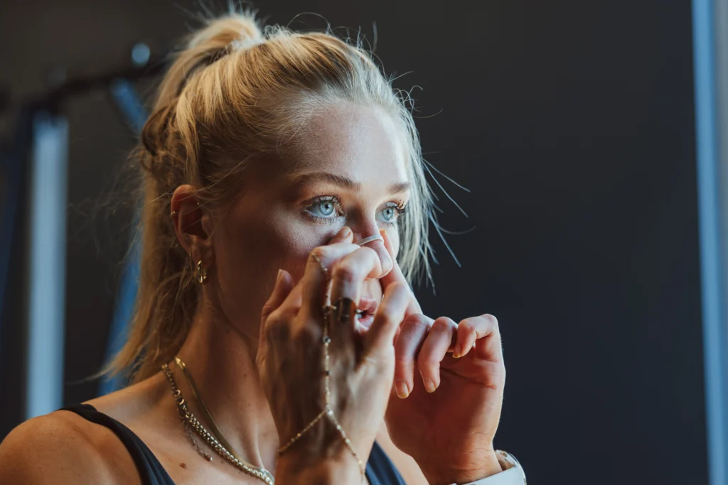 a woman wearing a nasal strip