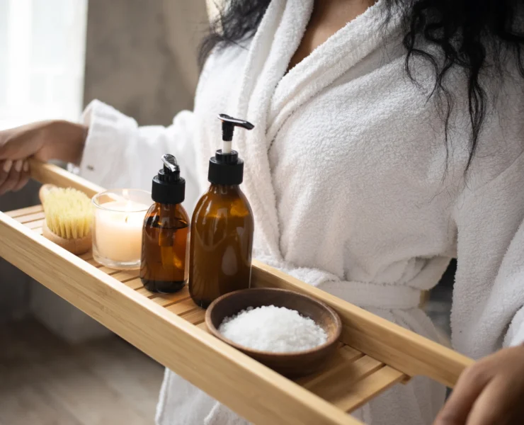 Woman inside a spa, holding tray