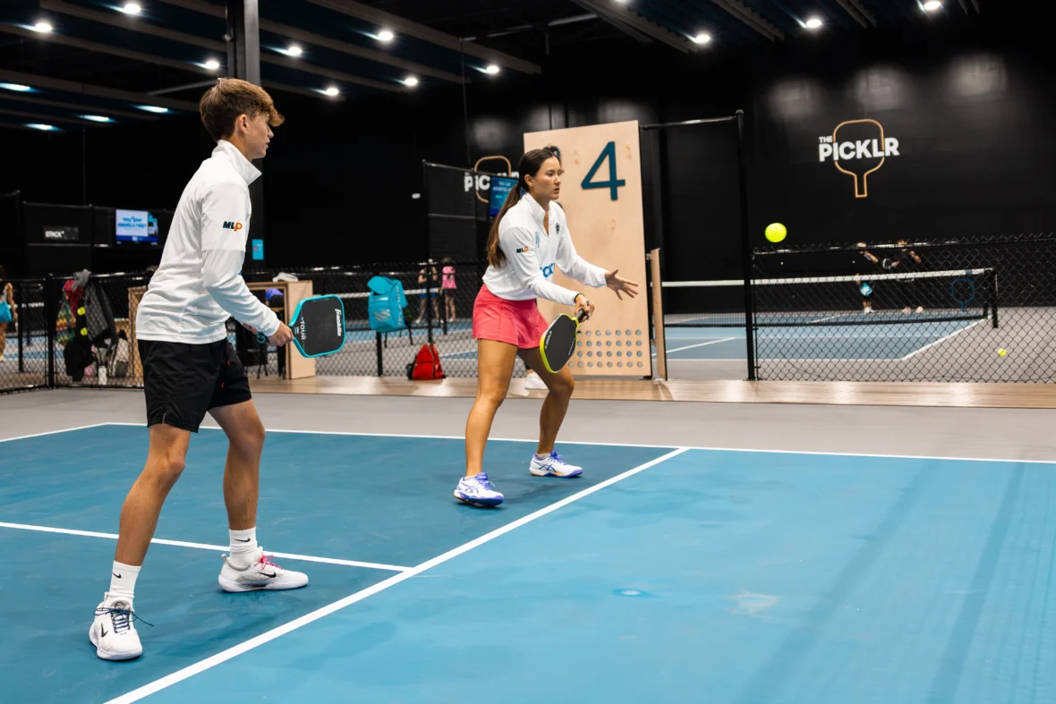 The Picklr and people playing on the court.