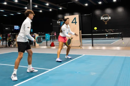 The Picklr and people playing on the court.