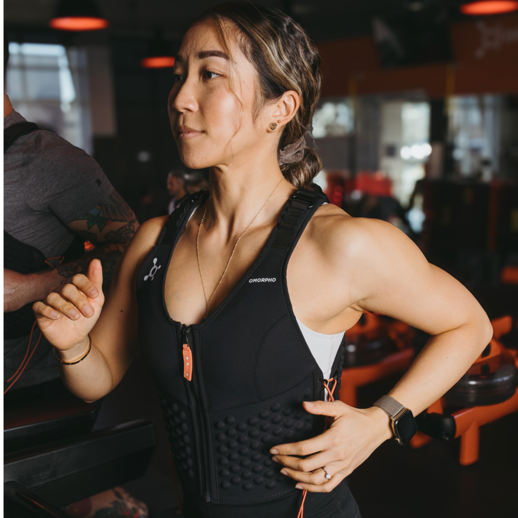 an Orangetheory member wearing an Omorpho vest