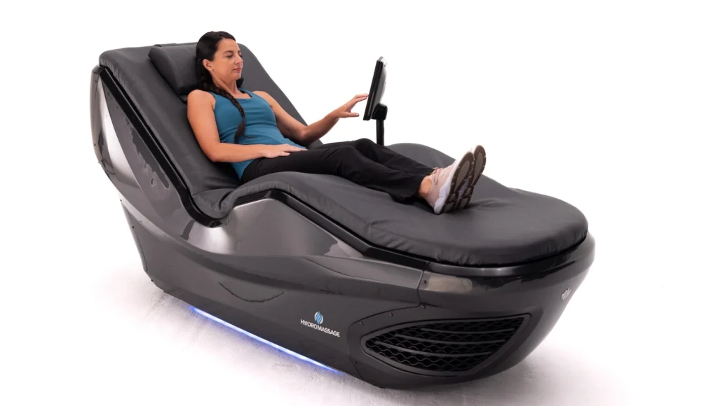 woman lies down in a WellnessSpace Brands bed