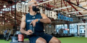 Man at Chelsea Piers fitness drinking Gainful products