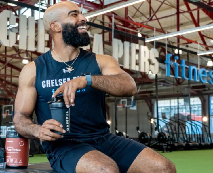 Man at Chelsea Piers fitness drinking Gainful products