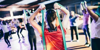 young girls in a gym class with resistance bands