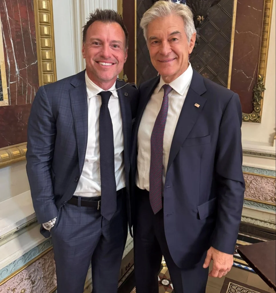 Anthony Geisler poses for a photo with Dr. Mehmet Oz