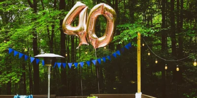 A table set up outdoors with balloons representing 40.
