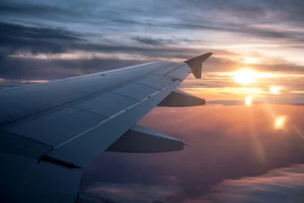 The wing of a plane in flight.