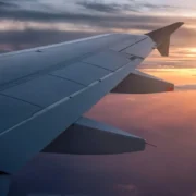 The wing of a plane in flight.
