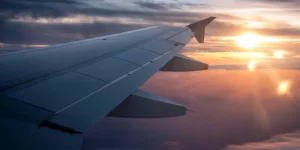 The wing of a plane in flight.