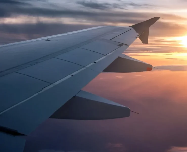 The wing of a plane in flight.