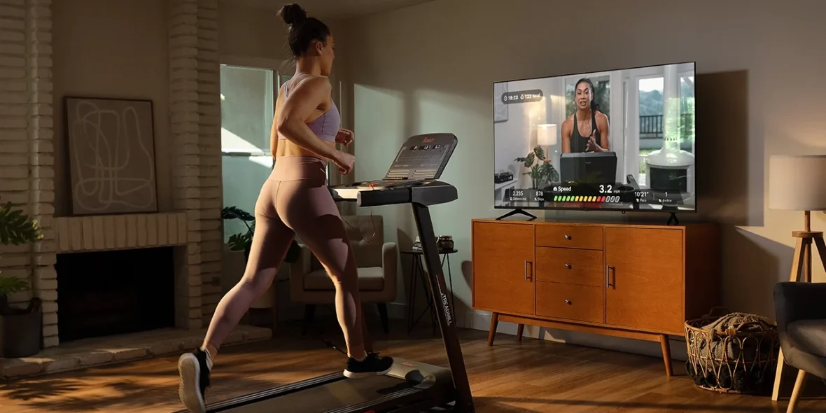 a woman working out in her living room