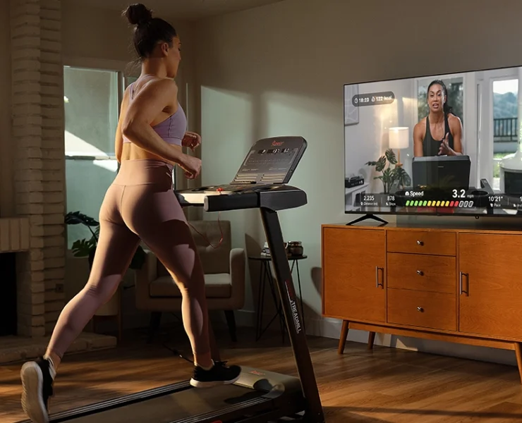 a woman working out in her living room
