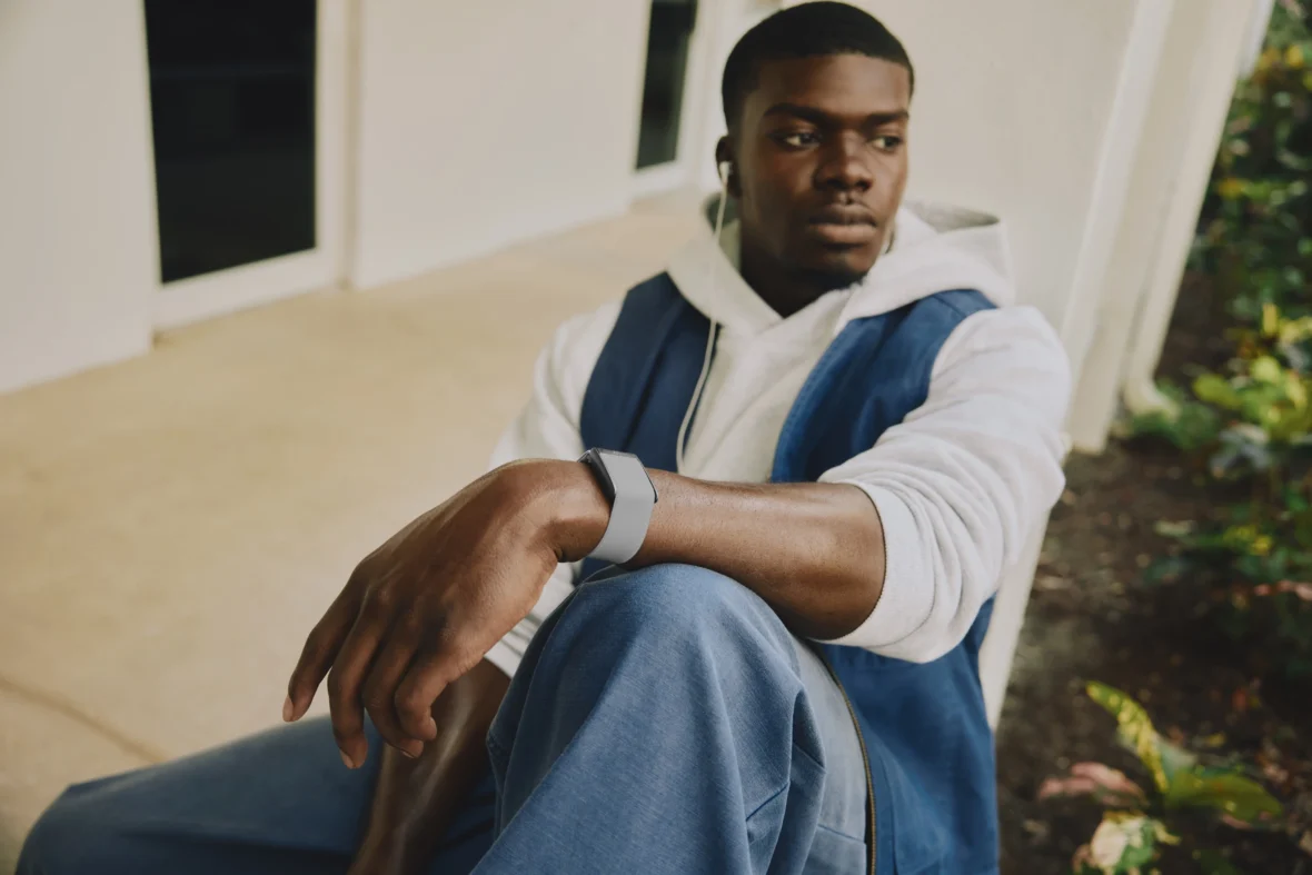 man wearing whoop device on wrist