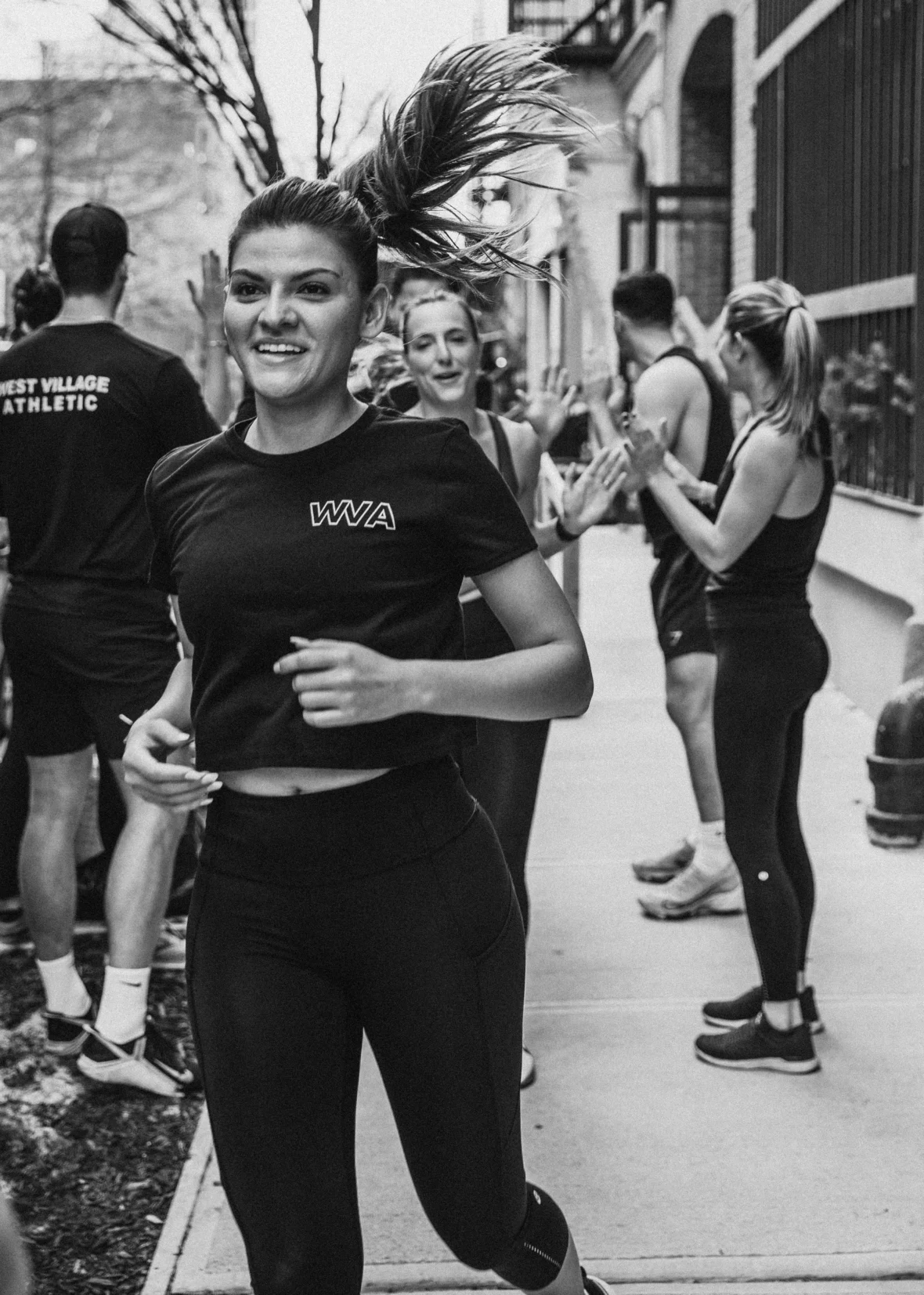 A small group training outdoors, running in NYC.