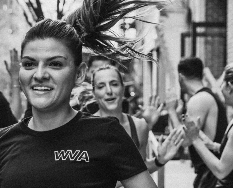 A small group training outdoors, running in NYC.