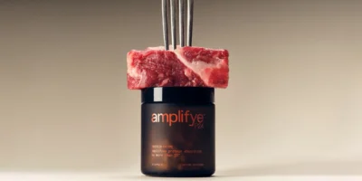 piece of steak on top of an amplifyeP24 supplement case