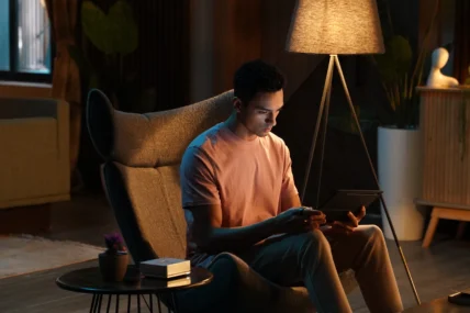 A man sitting in his living room.