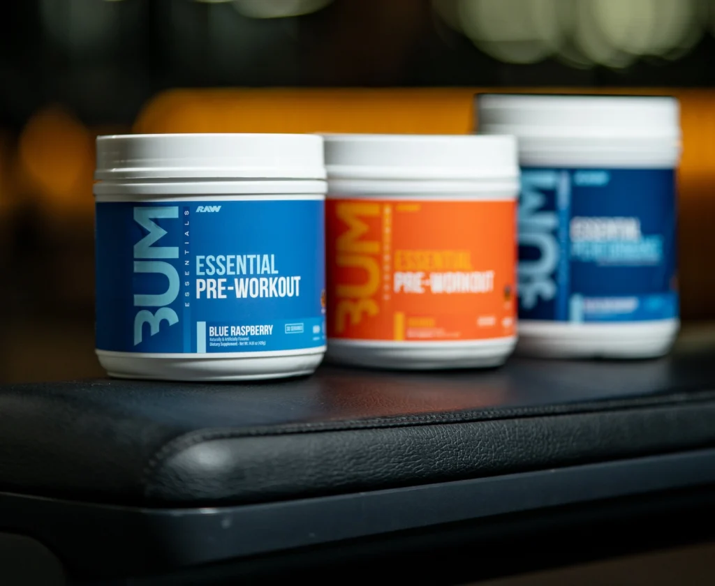 Raw Nutrition supplements displayed on a weightlifting bench