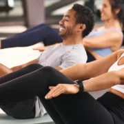 a man and two women doing crunches