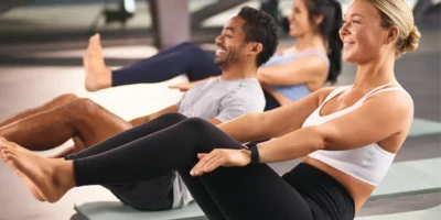 a man and two women doing crunches