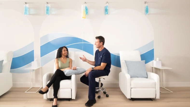 Dr. Brett Florie, board-certified anesthesiologist and founder of Hydration Room with a patient during an IV therapy consultation
