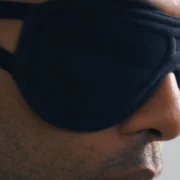 A man wearing a sleep mask from The Inactive Co.