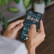 A man with his phone in his hand interacting with the Levels app.