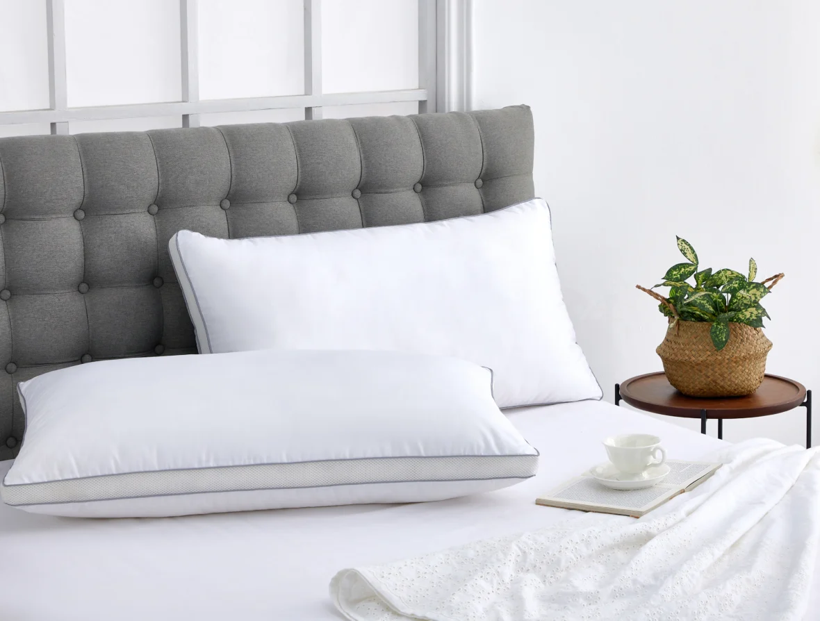 Two pillows on unmade bed