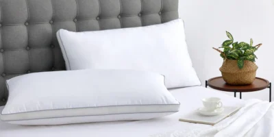 Two pillows on unmade bed
