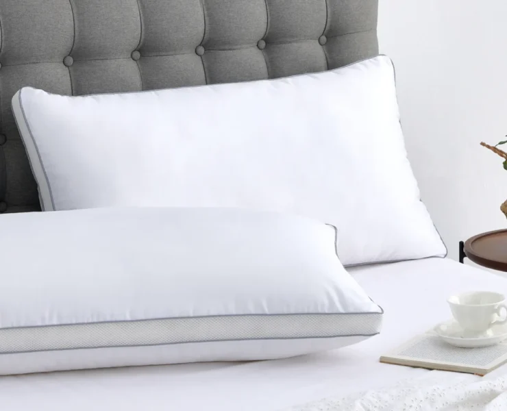 Two pillows on unmade bed