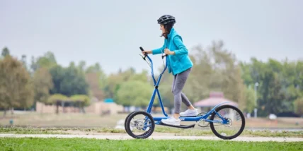 A woman using a device from Strider Fitness.
