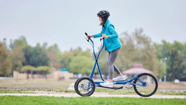 A woman using a device from Strider Fitness.
