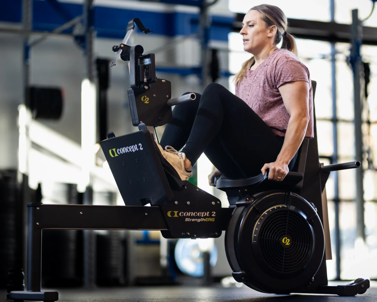 Woman using Concept2 StrengthErg